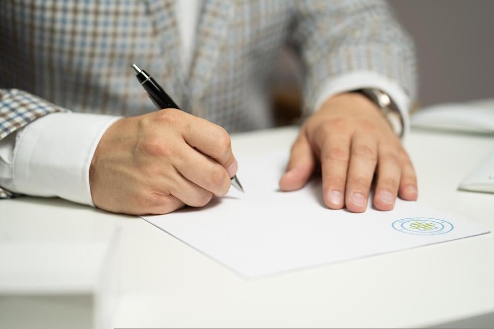 Older adult signing estate planning documents for incapacity planning