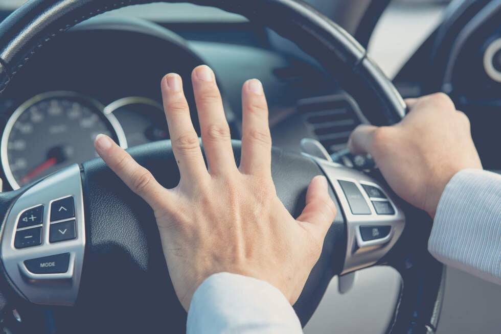 A driver showing aggressive driving behavior on a busy street in Las Vegas Nevada with legal insights from Gallo Criminal Defense Las Vegas
