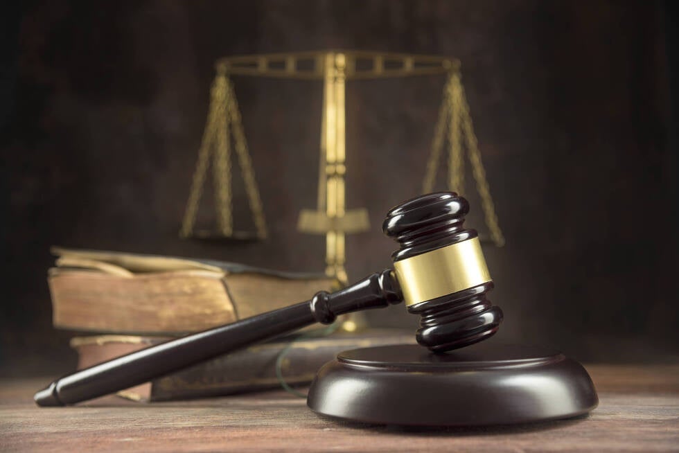 A courtroom scene in Las Vegas, Nevada where a judge reviews bail eligibility as an attorney from Gallo Criminal Defense Las Vegas advises the defendant.