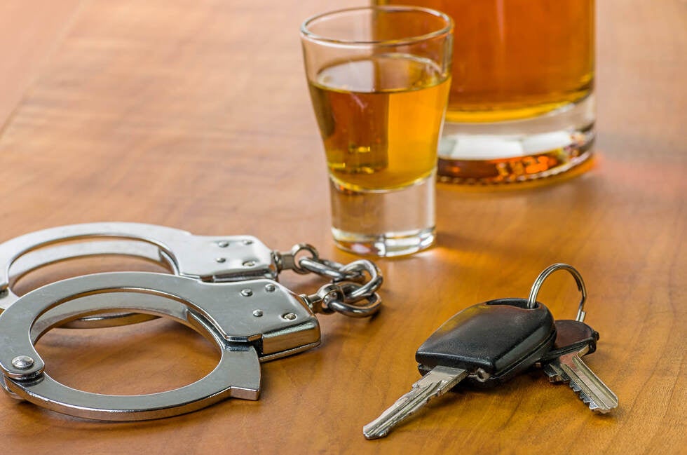 A lawyer from Gallo Criminal Defense Las Vegas meets with a client in Las Vegas Nevada to discuss the long term consequences of a DUI conviction and the impact on their driver’s license and legal record.