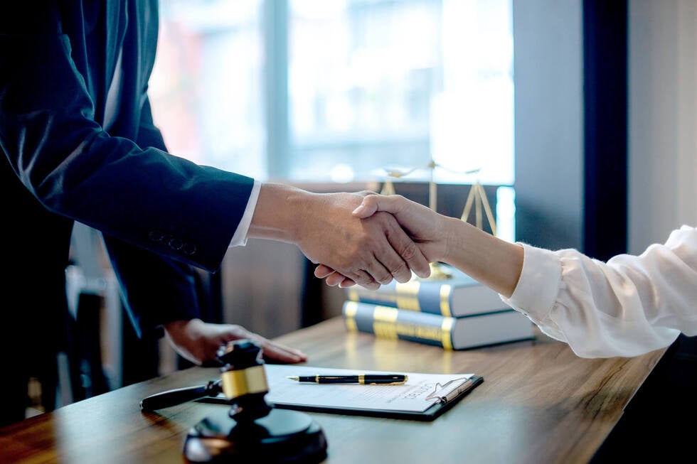An experienced attorney at Gallo Criminal Defense Las Vegas reviewing arrest records and legal documents in Las Vegas Nevada to identify constitutional violations in a drug possession case.