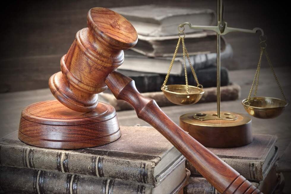 A close up view of legal documents and a wooden gavel on a desk representing the meticulous case preparation of a Gallo Criminal Defense Las Vegas lawyer for a trial held in Las Vegas, Nevada.