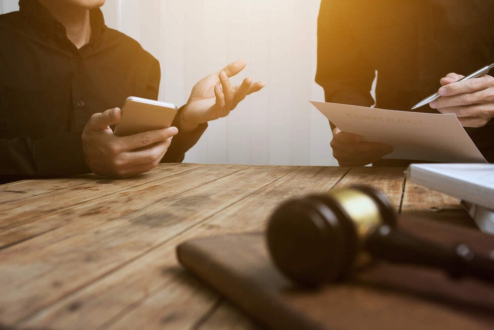A professional meeting at Gallo Criminal Defense Las Vegas in Las Vegas Nevada to discuss defense strategies for sexual assault lawsuits.