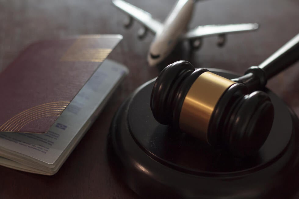A wooden legal gavel on a courtroom desk symbolizing the strict laws and legal procedures managed by Gallo Criminal Defense Las Vegas Nevada for out of state clients
