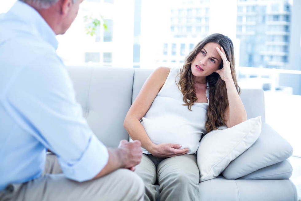 Woman pregnant at work