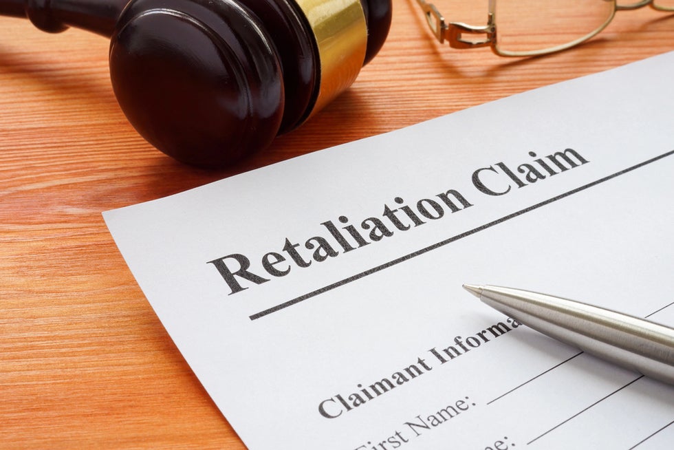 Person filling out retaliation claim form