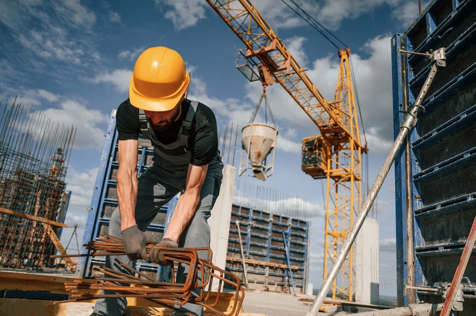Construction worker thinking about wage theft