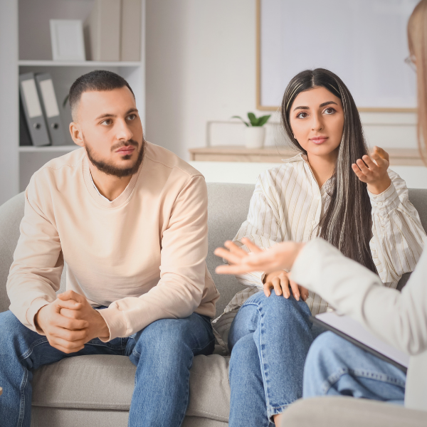 Couple meeting with a mediator during a divorce mediation session in Illinois