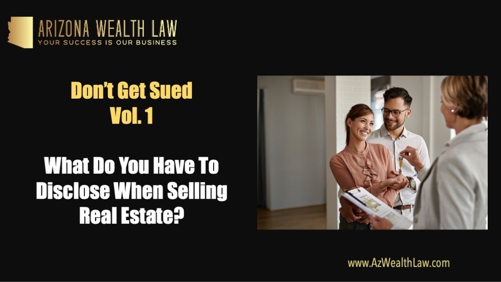 A seller handing keys to a happy real estate buyer