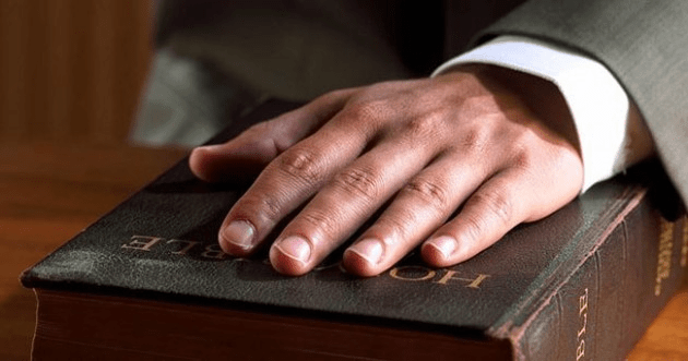 Right hand on the Bible