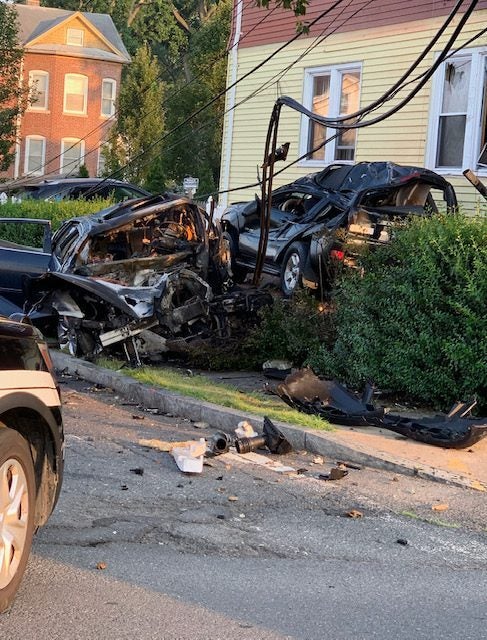 Two heavily damaged cars in a yard after a Hartford, CT car acident
