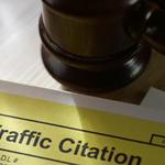 A photo of a traffic citation and a gavel.