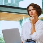 Woman looking for traffic lawyer on her computer.