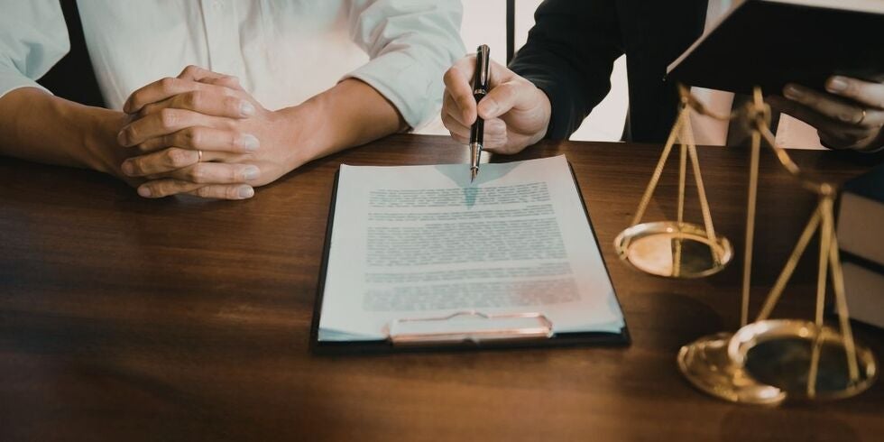 A client consulting with a lawyer.