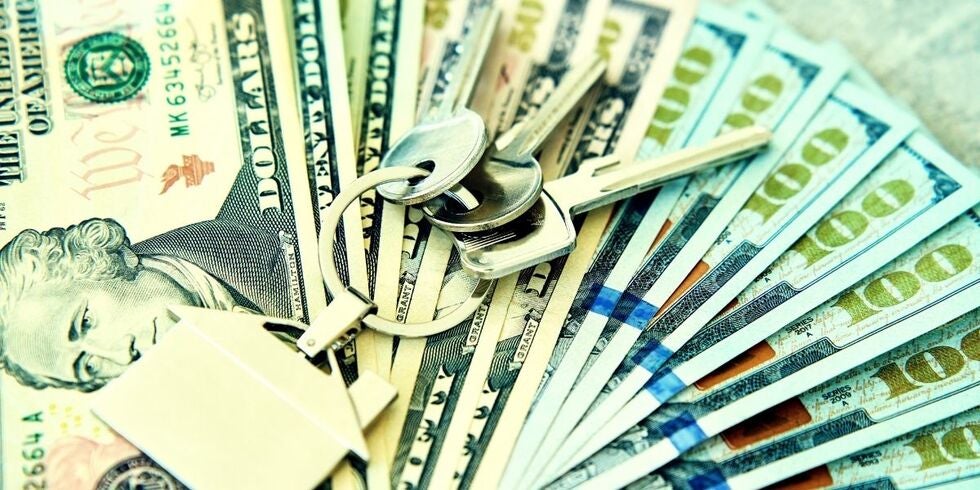 Car keys sitting on money