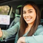 A woman happy to have a new driver's license