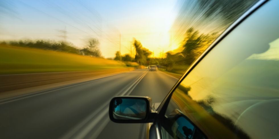 A car driving fast on a highway
