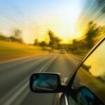A car driving fast on a highway