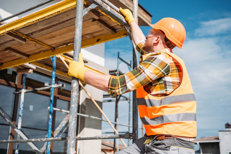Man working on scaffolding before fall