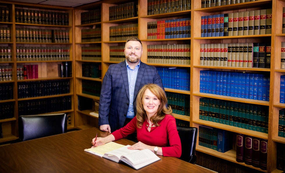 Attorneys Ryan Smith and Melanie Lane in Romer and Lane Library