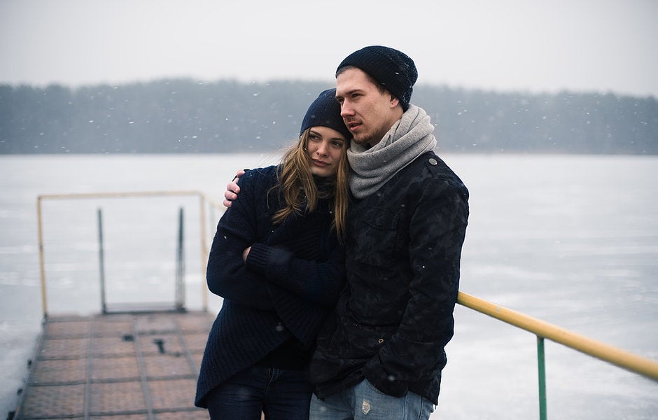 Couple Hugging on a Pier