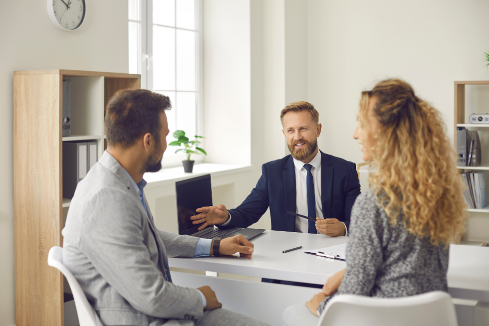 couple in law office discussing trust vs will