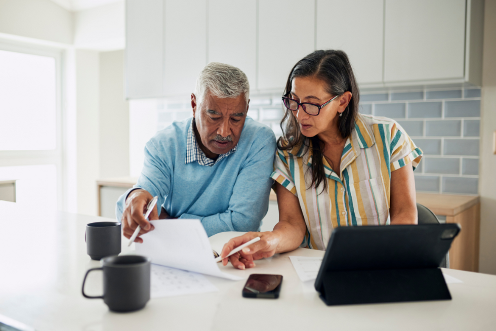 couple looking at Missouri property deed