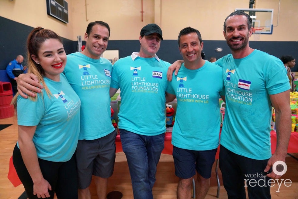Priscilla Roman, Robert Sena, Aaron Resnick, Charlie Venturi and Jonathan Babicka at the 2018 holiday toy distribution at North Shore Park and Youth Center.