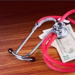 red stethoscope and money