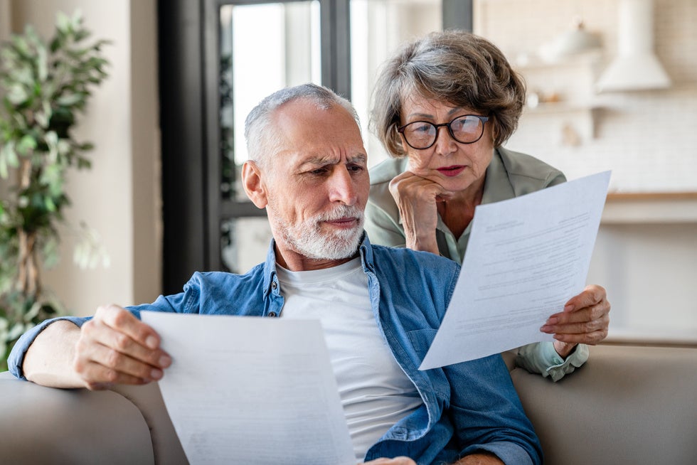 An elderly couple creating a will together