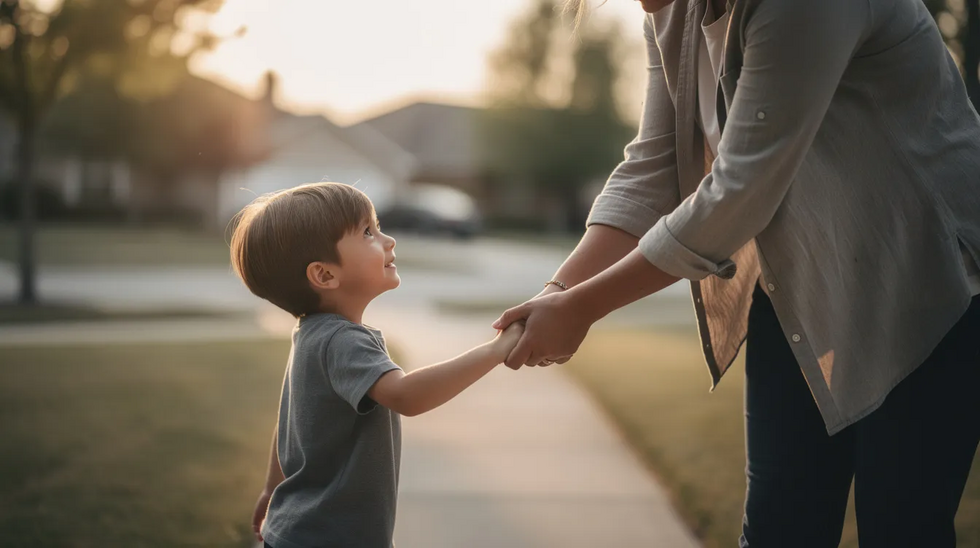The image shows a parent gently holding a young child's hand, symbolizing protection and support in their relationship. This visual reinforces the importance of child custody matters and the well-being of children in family law cases.