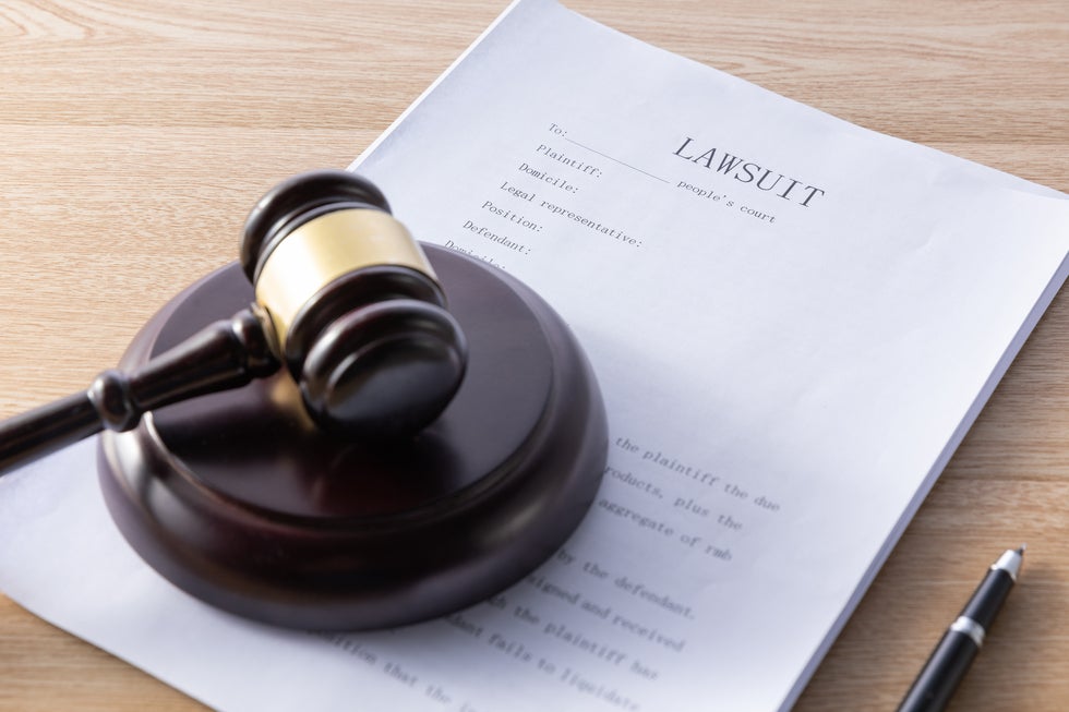 Gavel and lawsuit document on desk, symbolizing criminal law legal services in Surf City, NJ