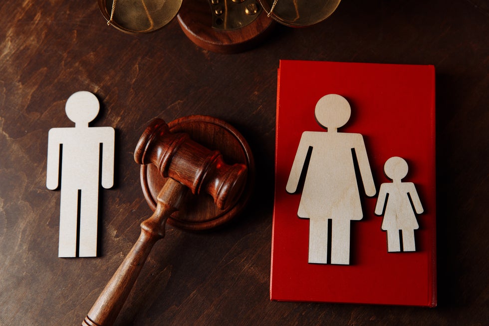 Gavel and wooden family cutouts symbolizing family law and child custody matters in Ship Bottom, NJ