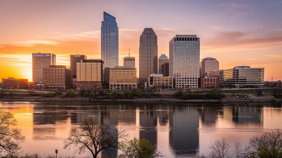 The image captures the Dallas, Texas skyline at sunset, showcasing modern buildings silhouetted against a vibrant orange and purple sky. This scene reflects the dynamic city known for its legal landscape, including property division cases and community property considerations in divorce proceedings.