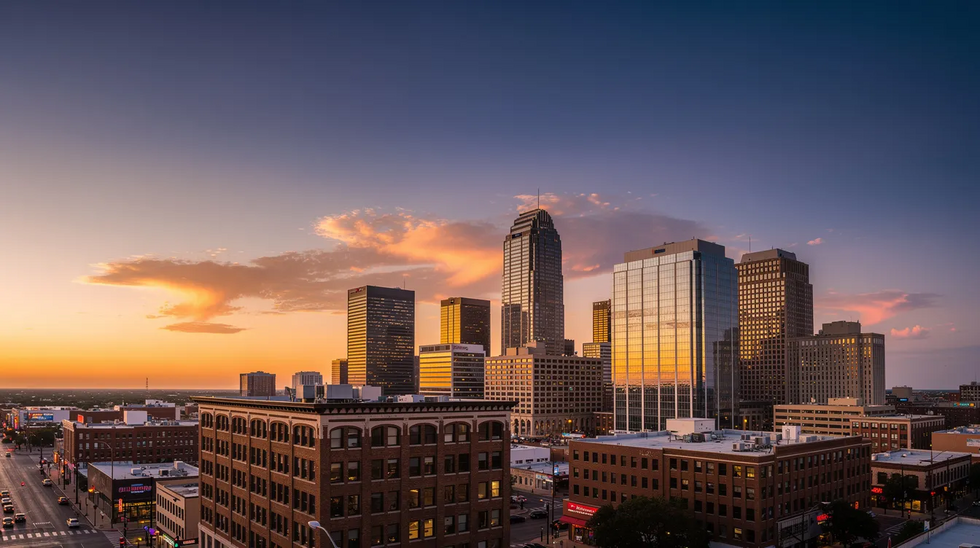 The image depicts a Texas city skyline at sunset, showcasing tall buildings silhouetted against a vibrant sky filled with hues of orange and purple. This scene reflects the beauty of urban life in Texas, a place where families navigate important legal matters such as child custody and visitation rights.