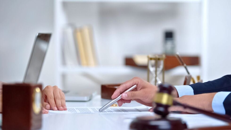 A woman consulting with her time-sharing and parenting attorney.