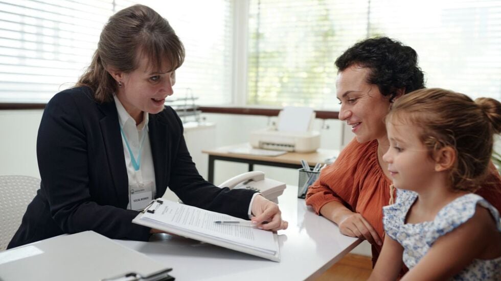 Segarra Law Firm image of a mother and child meeting with a legal professional in an office, representing parenting agreements and family law guidance in Miami.