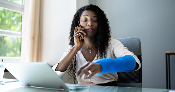 woman in cast worried about medical bills due to a car accident