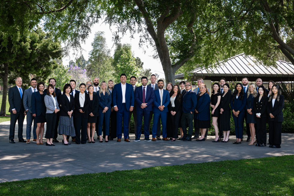 Kimura London & White LLP staff members in a group photo at the park.