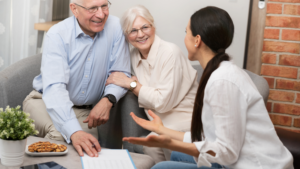 happy old couple talking to an estate planning attorney