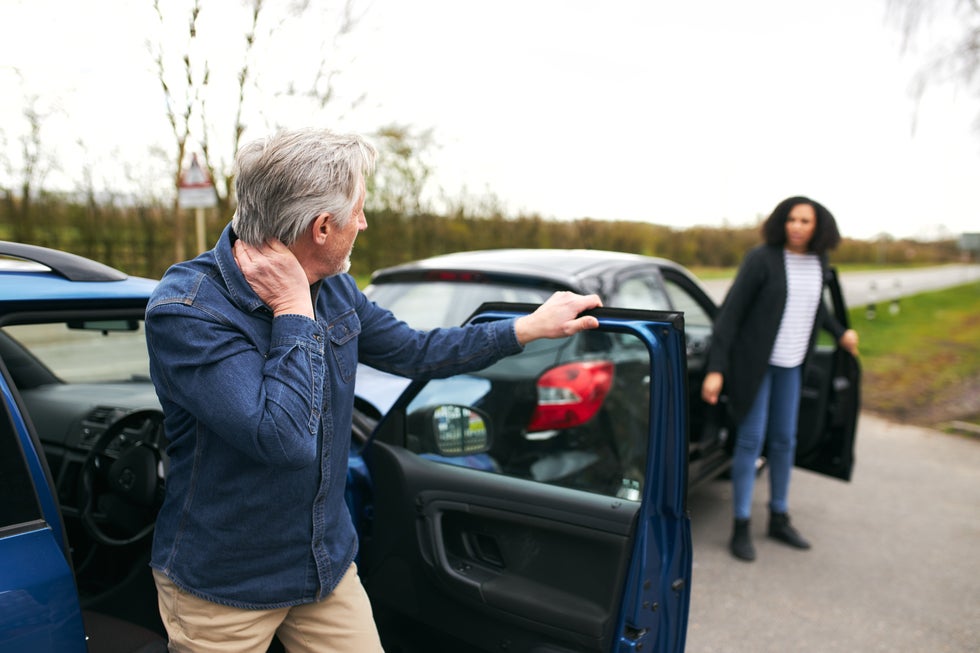 Injured driver holding neck after car accident – Khorozian Law Group personal injury attorneys serving Englewood Cliffs and Bergen County NJ