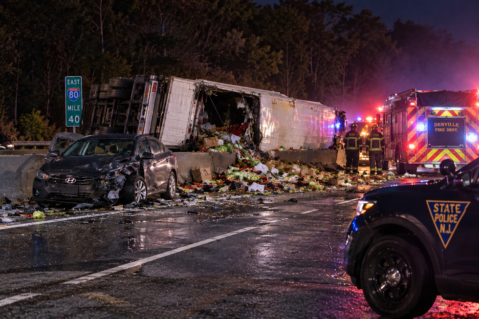 Illustration of an overturned produce tractor-trailer and damaged car after an I-80 crash in Denville, New Jersey