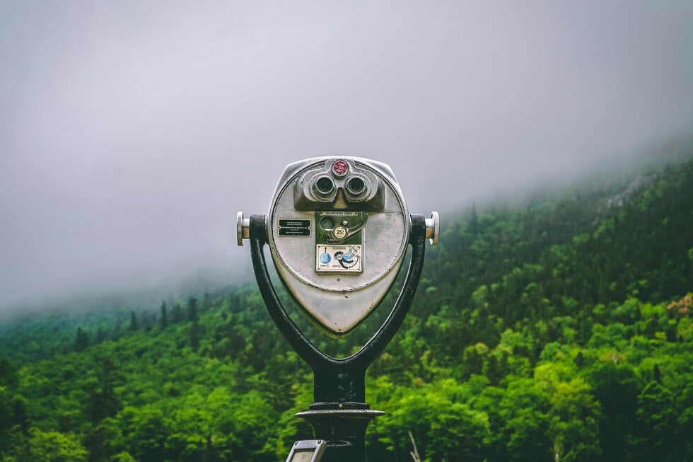 Binoculars symbolizing searching for insurance coverage after a car accident