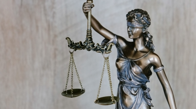 Statue of the Blind Goddess of Justice holding scales