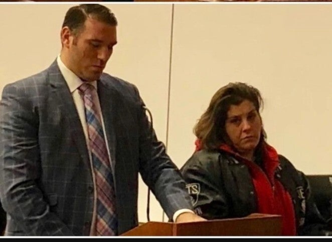 Krystal Isolda standing with her attorney, Yan Katsnelson. 