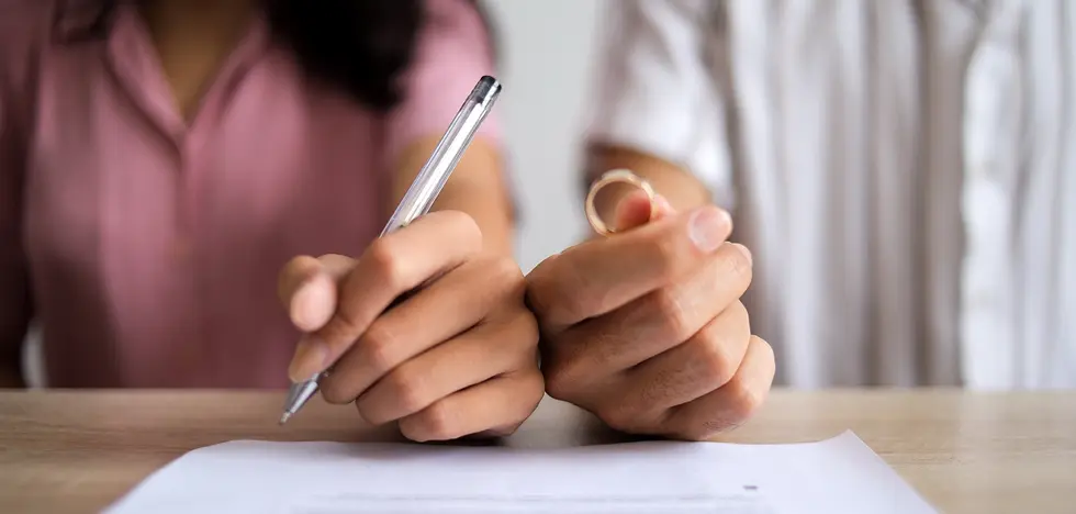 Couple Signs Legal Documents