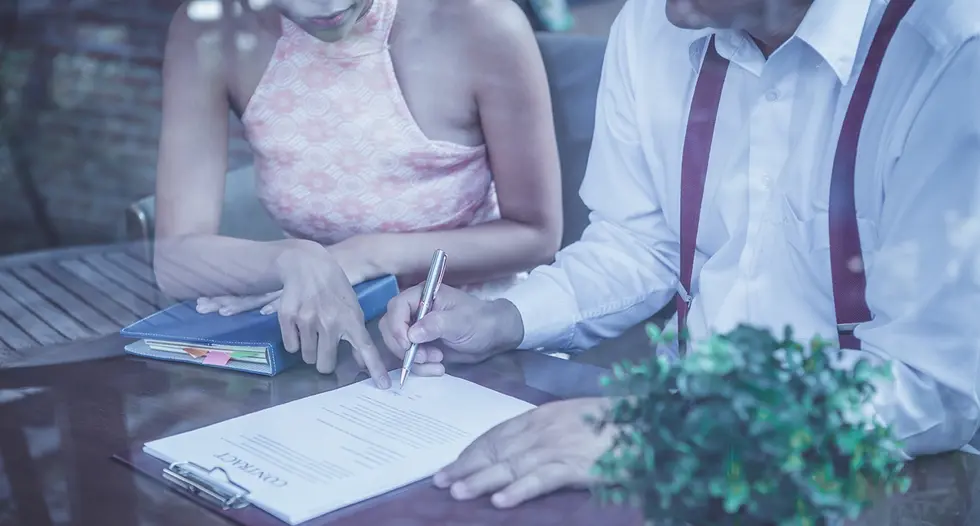 Couple signs premarital agreement