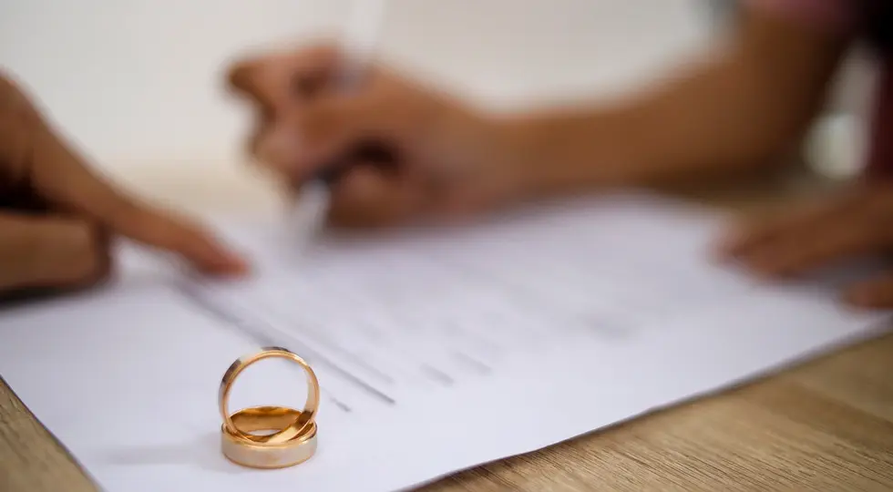 Couple signs postnuptial agreements 