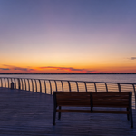 Empty bench overlooking Charlotte Harbor in Punta Gorda, Florida, where families face probate without a will