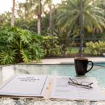Life insurance policy and beneficiary designation forms on a Naples lanai table, illustrating life insurance and estate planning in Florida.